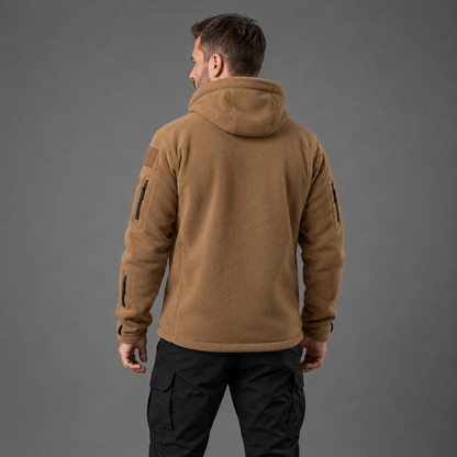 Man wearing brown tactical thermal fleece jacket in rear studio view