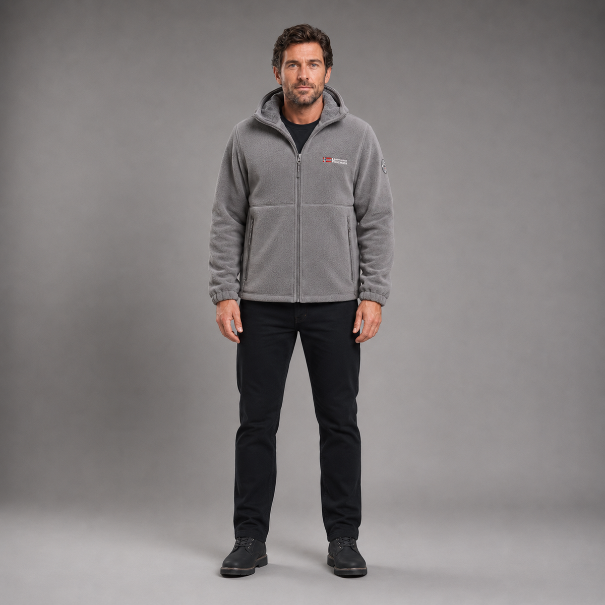 Man wearing gray thermal fleece jacket in full-body front studio view
