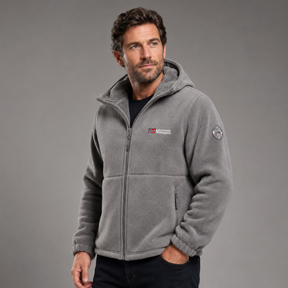 Man wearing gray thermal fleece jacket in three-quarter studio view